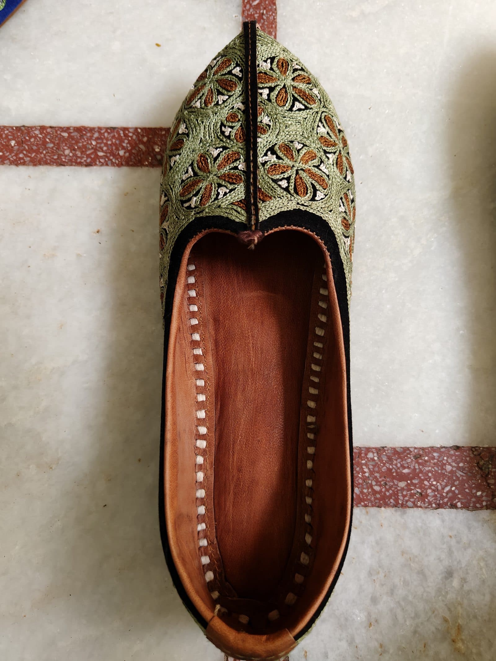Hand-laid zardozi on maroon velvet: the Jodhpuri Royal in progress.